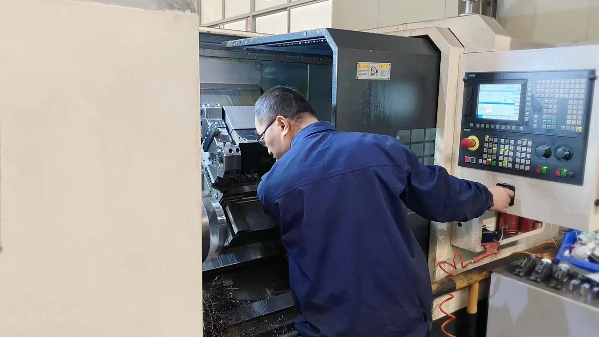 Worker at a CNC machine